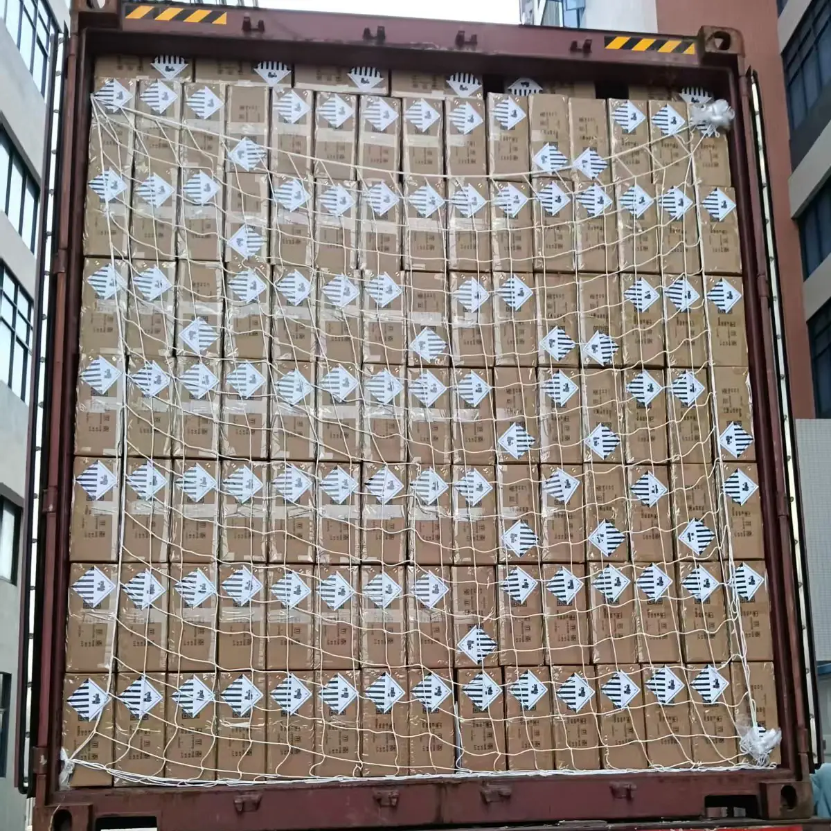 A 40HQ export container fully loaded with Xiuben cartons and strapped for shipment
