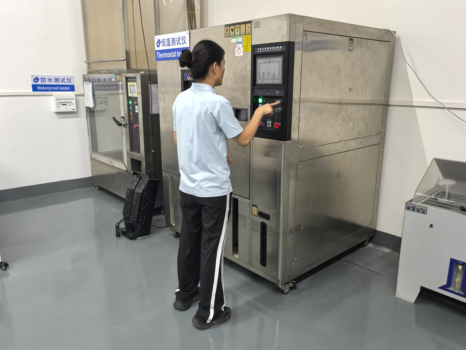 Technician programming the constant-temperature test chamber